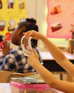 Second-graders got a lesson in economics at Woodlin Elementary School Friday. (WTOP/Kate Ryan)
